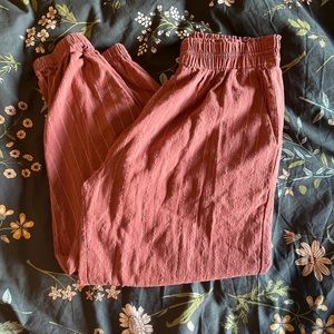 Women’s coral dressy cuffed pants. Size S